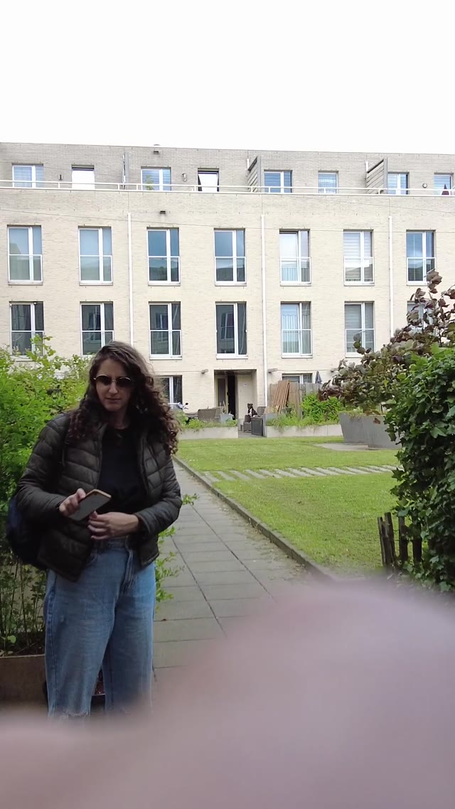 posing for camera · outdoor courtyard