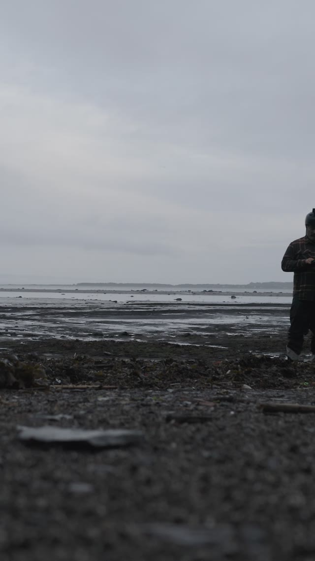 standing by water · muddy shoreline