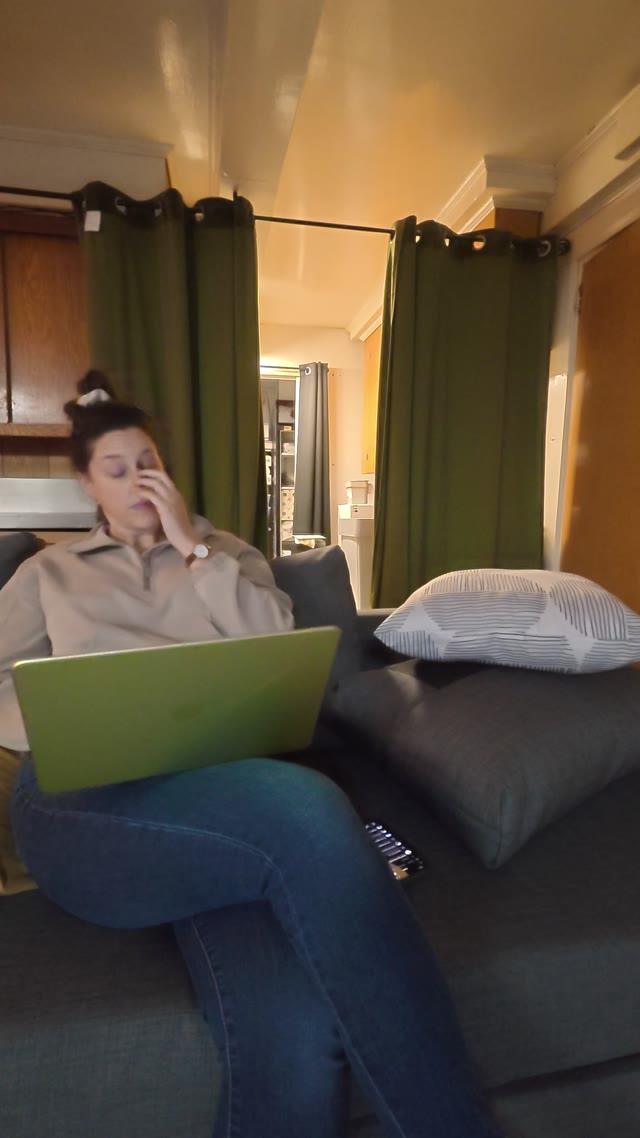 working on laptop · indoor living room