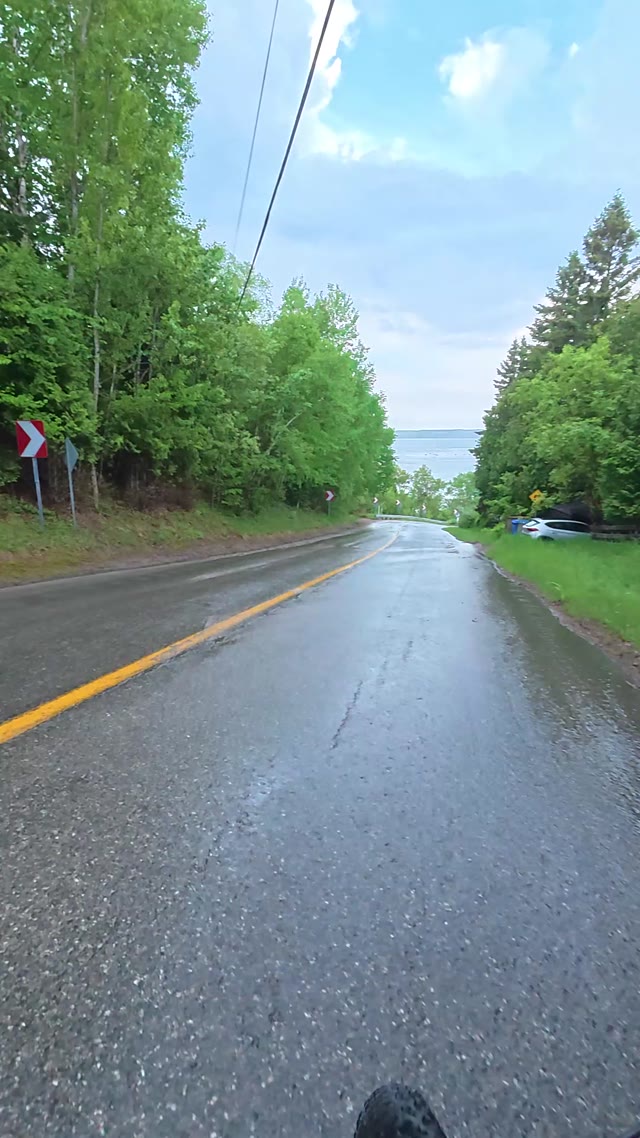 driving on road · winding road near water