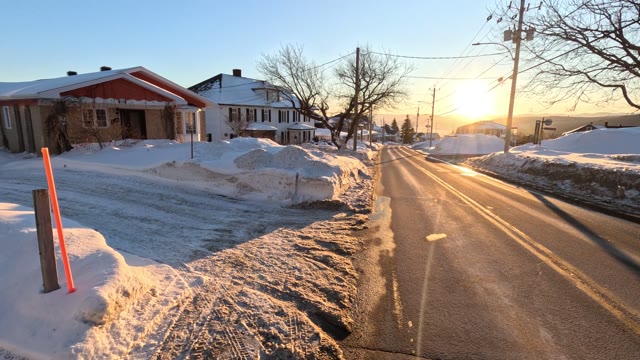 walking down road · snowy residential street