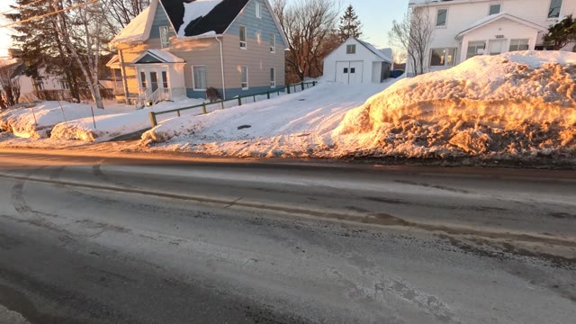 walking down road · snowy residential area
