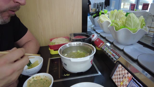 eating hotpot · restaurant